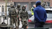 Belgium: police hunt for gunmen after Brussels shooting